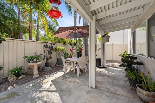 view of patio / terrace with a fenced backyard and outdoor dining area