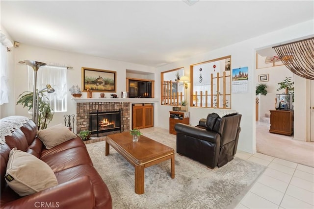living area with light tile patterned floors, light colored carpet, and a brick fireplace
