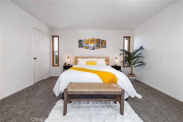 bedroom with carpet floors, multiple windows, and baseboards