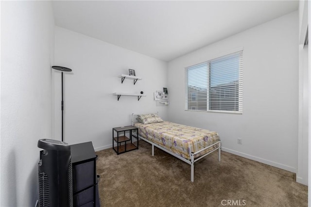 bedroom featuring carpet flooring and baseboards
