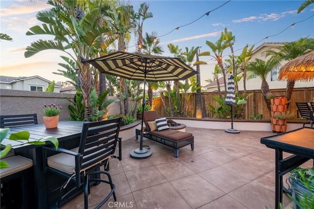 view of patio featuring outdoor dining space and a fenced backyard