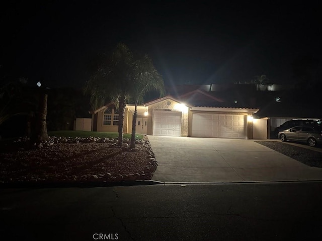 view of front of home featuring an attached garage and driveway