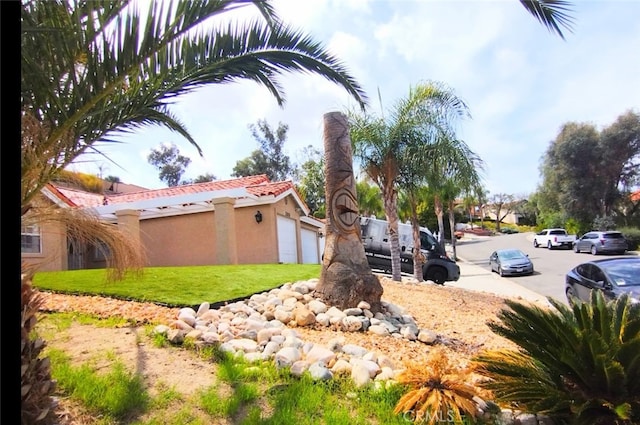 view of yard featuring a garage