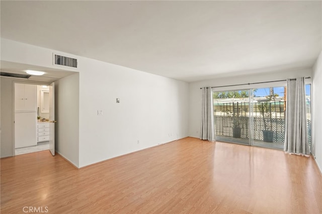10240 Camarillo St Unit 204, Toluca Lake, CA 91602 - unfurnished room with light wood-type flooring and visible vents