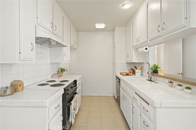10240 Camarillo St Unit 204, Toluca Lake, CA 91602 - kitchen with white cabinets, a sink, tasteful backsplash, black electric range oven, and tile counters