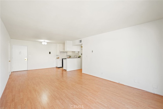 10240 Camarillo St Unit 204, Toluca Lake, CA 91602 - unfurnished living room with light wood-style floors, visible vents, and a sink