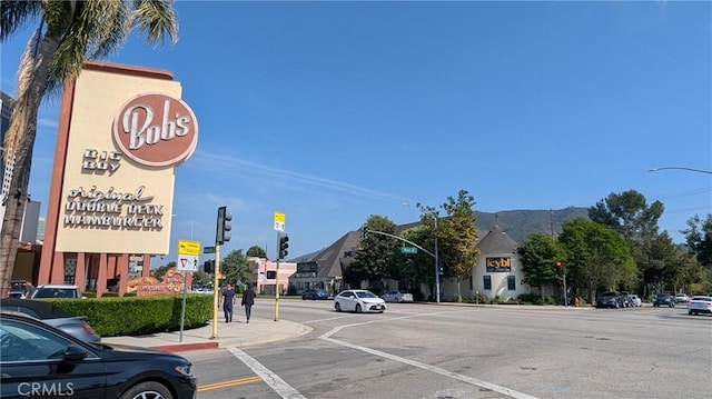10240 Camarillo St Unit 204, Toluca Lake, CA 91602 - view of road featuring sidewalks, traffic signs, street lighting, traffic lights, and curbs