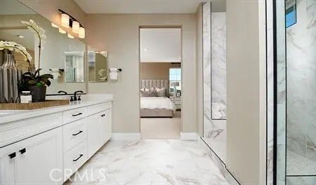 bathroom with vanity, baseboards, ensuite bath, a shower with shower door, and marble finish floor