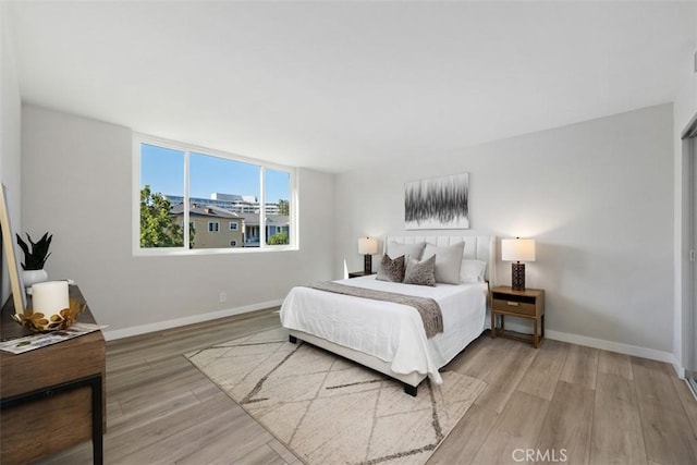 9950 Durant Dr Unit 208, Beverly Hills, CA 90212 - bedroom featuring wood finished floors and baseboards