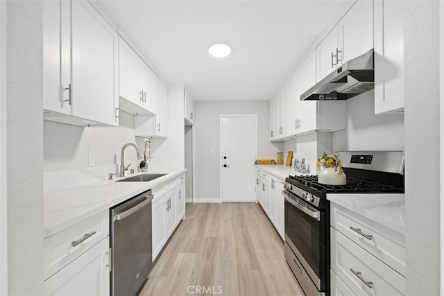 9950 Durant Dr Unit 208, Beverly Hills, CA 90212 - kitchen with stainless steel appliances, under cabinet range hood, a sink, light wood finished floors, and white cabinetry