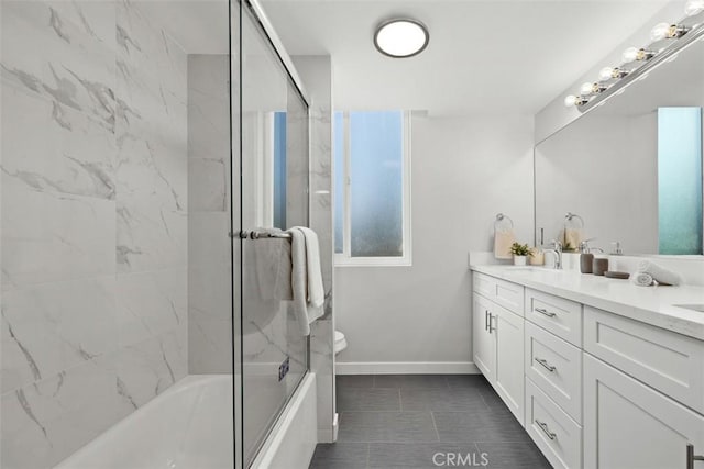 9950 Durant Dr Unit 208, Beverly Hills, CA 90212 - full bathroom featuring double vanity, washtub / shower combination, baseboards, tile patterned floors, and toilet