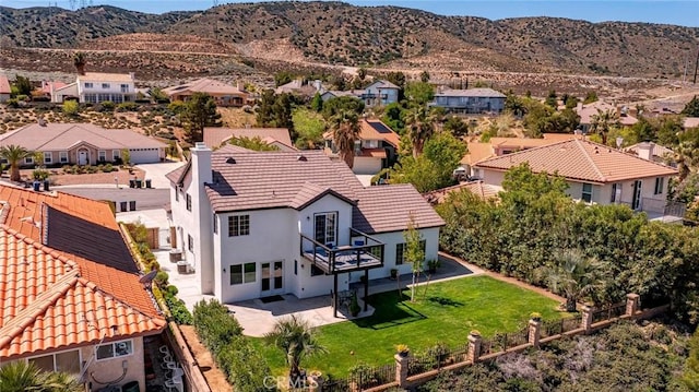 drone / aerial view with a residential view and a mountain view