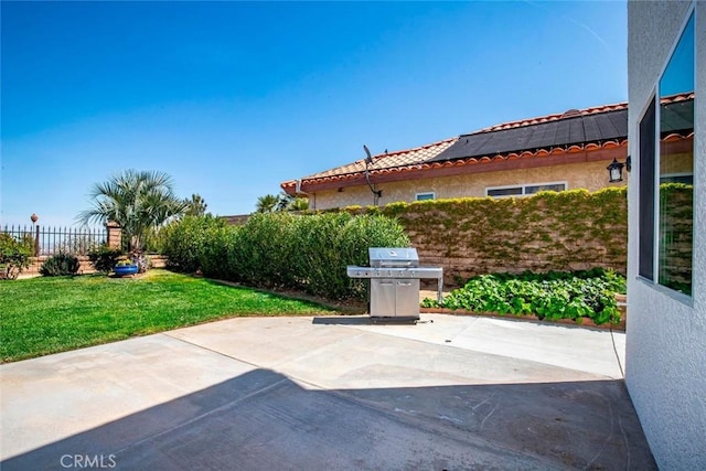 view of patio / terrace featuring grilling area and fence
