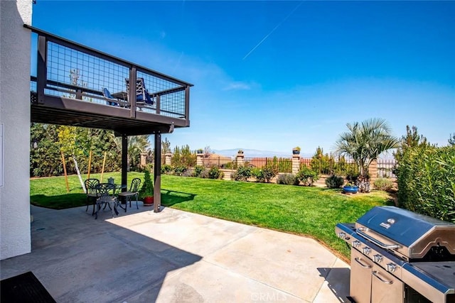 view of patio / terrace featuring fence and a wooden deck