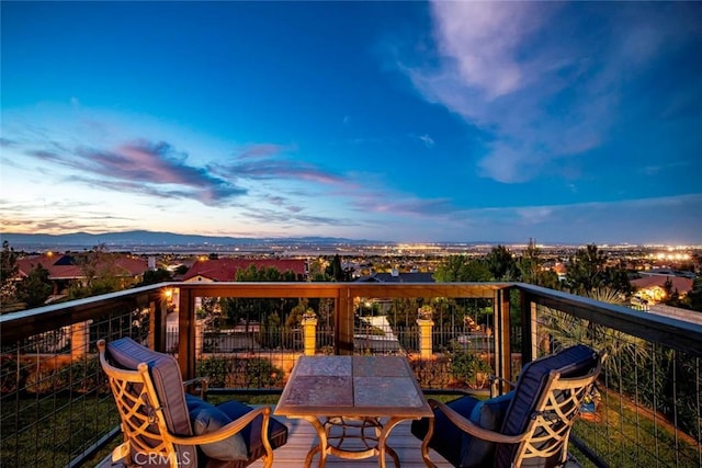 view of balcony at dusk