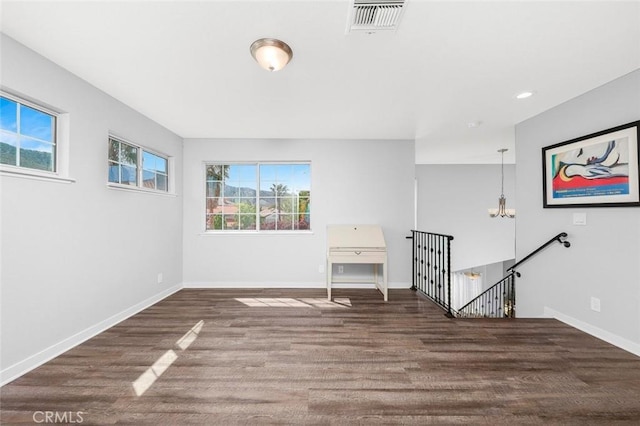 unfurnished room with recessed lighting, visible vents, baseboards, and wood finished floors