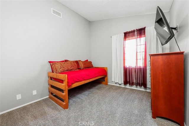 bedroom with visible vents, baseboards, and carpet flooring
