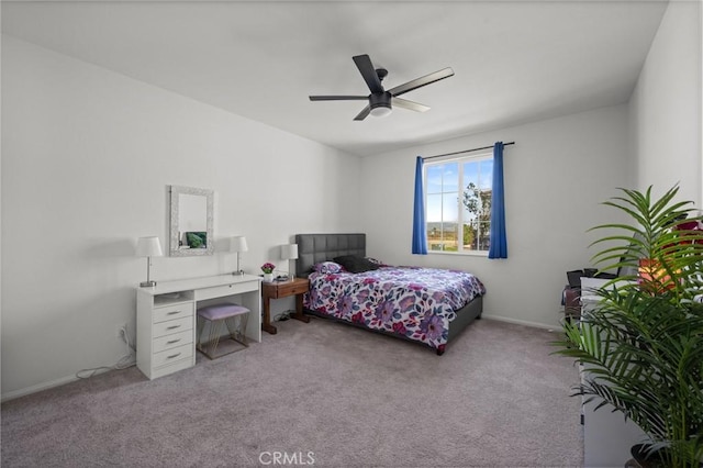 bedroom featuring a ceiling fan, baseboards, and light colored carpet