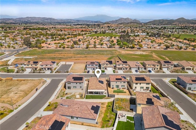 aerial view with a mountain view and a residential view