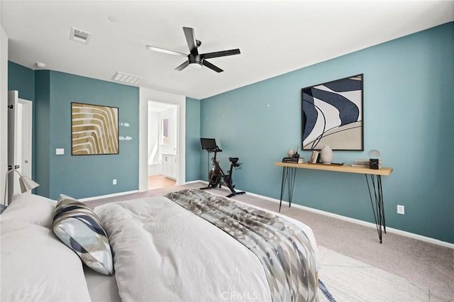 bedroom featuring baseboards, carpet flooring, ensuite bath, and visible vents