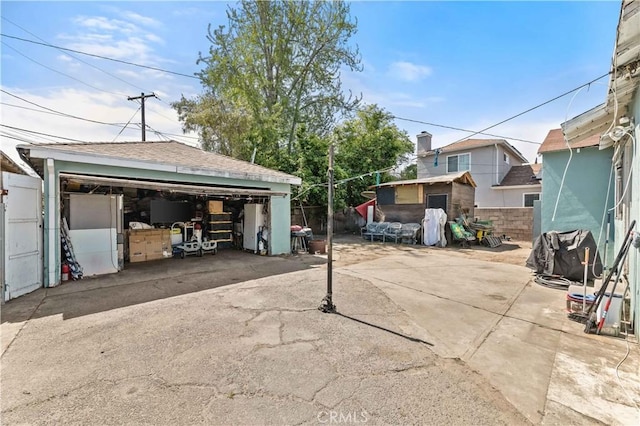 4516 Shasta Pl, El Monte, CA 91731 - view of patio / terrace featuring a garage, fence, and an outdoor structure