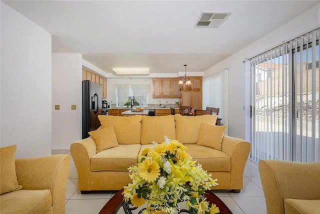 3594 N Verbena, Rialto, CA 92377 - living area with light tile patterned flooring and a chandelier
