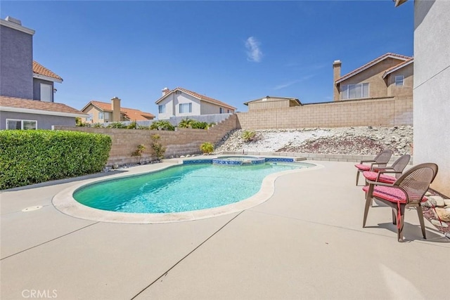 3594 N Verbena, Rialto, CA 92377 - view of swimming pool featuring a fenced backyard, a patio, and a pool with connected hot tub