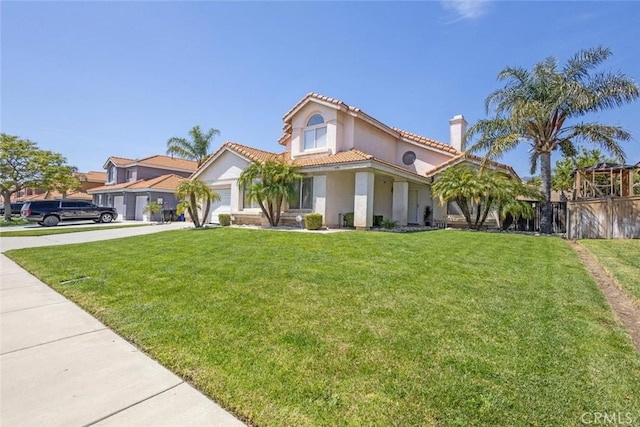 3594 N Verbena, Rialto, CA 92377 - mediterranean / spanish house featuring driveway, a garage, a chimney, stucco siding, and a tiled roof
