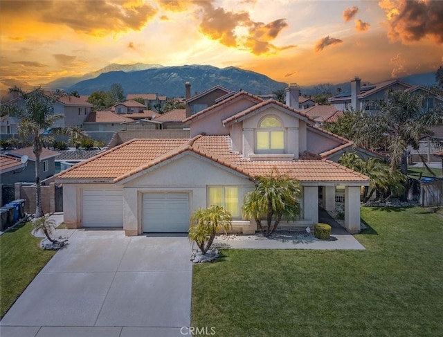 3594 N Verbena, Rialto, CA 92377 - mediterranean / spanish house with a mountain view, a tiled roof, stucco siding, and concrete driveway