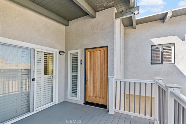 doorway to property with stucco siding