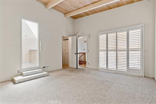 unfurnished bedroom featuring lofted ceiling with beams, carpet floors, access to exterior, wooden ceiling, and visible vents