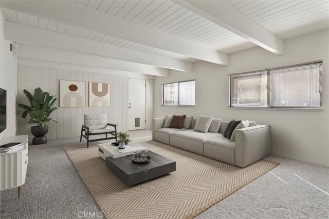 living room featuring carpet floors and beam ceiling