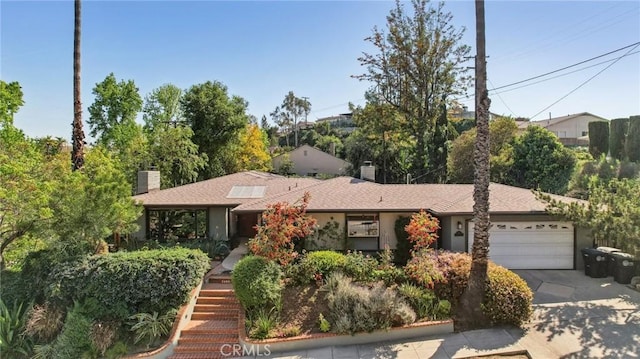1460 E Glenoaks Blvd, Glendale, CA 91206 - view of front of house with a chimney, a garage, concrete driveway, and stairway
