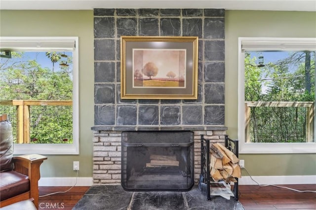 1460 E Glenoaks Blvd, Glendale, CA 91206 - detailed view of baseboards, a stone fireplace, and wood finished floors