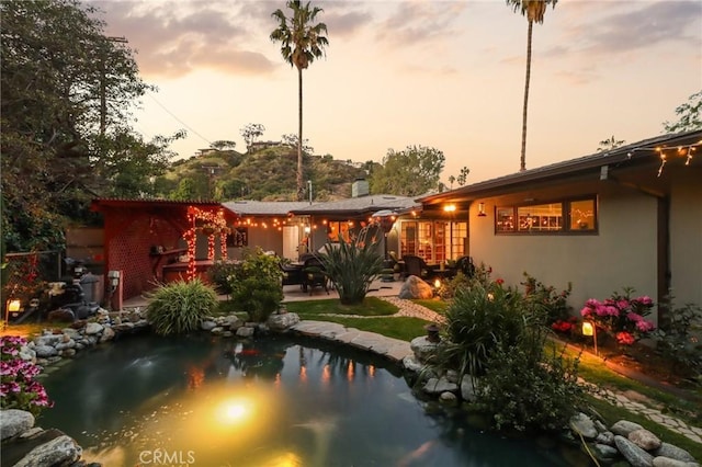 1460 E Glenoaks Blvd, Glendale, CA 91206 - rear view of property with stucco siding and a patio