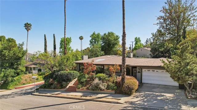 1460 E Glenoaks Blvd, Glendale, CA 91206 - view of front of home with a garage, driveway, and a chimney