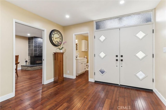 1460 E Glenoaks Blvd, Glendale, CA 91206 - entrance foyer with dark wood-style flooring, a tiled fireplace, recessed lighting, and baseboards