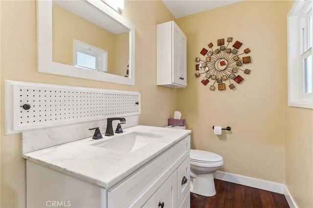 1460 E Glenoaks Blvd, Glendale, CA 91206 - bathroom with baseboards, vanity, toilet, wood finished floors, and plenty of natural light