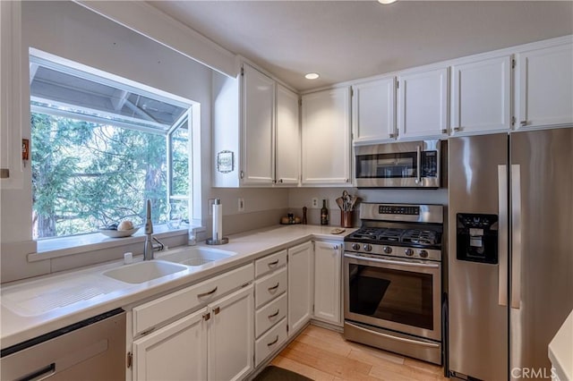381 Old Toll Rd, Lake Arrowhead, CA 92317 - kitchen with a sink, light countertops, white cabinets, and appliances with stainless steel finishes