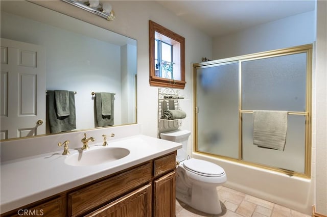 381 Old Toll Rd, Lake Arrowhead, CA 92317 - bathroom featuring toilet, stone finish floor, vanity, and shower / bath combination with glass door