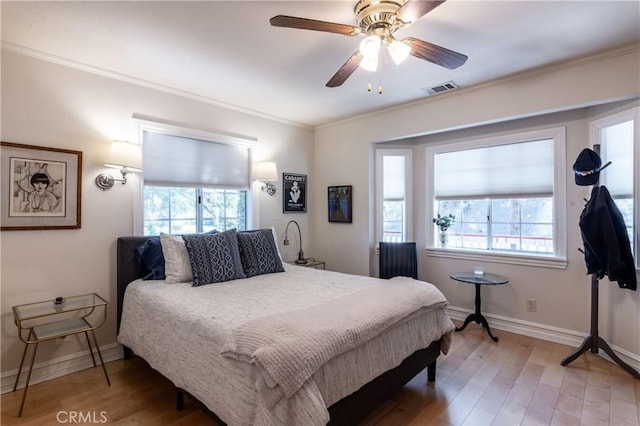 381 Old Toll Rd, Lake Arrowhead, CA 92317 - bedroom featuring light wood-type flooring, visible vents, baseboards, and crown molding