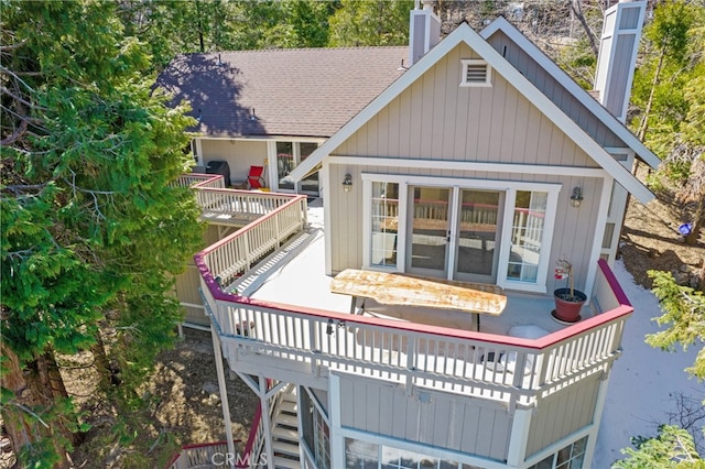 381 Old Toll Rd, Lake Arrowhead, CA 92317 - back of property featuring roof with shingles, a chimney, a deck, and stairway