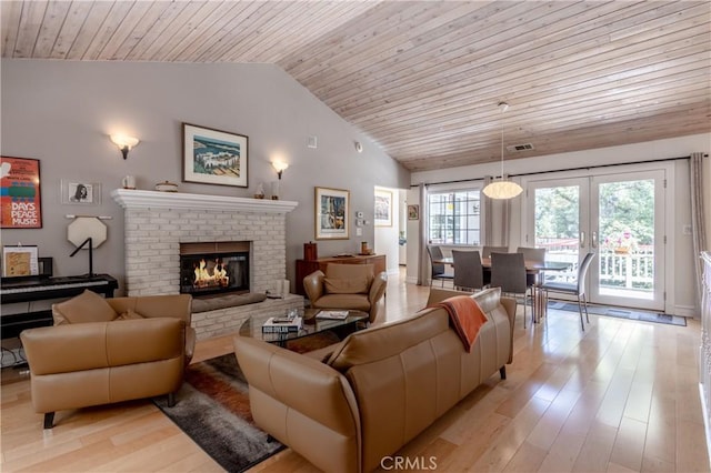 381 Old Toll Rd, Lake Arrowhead, CA 92317 - living area featuring wood ceiling, light wood finished floors, a brick fireplace, and vaulted ceiling