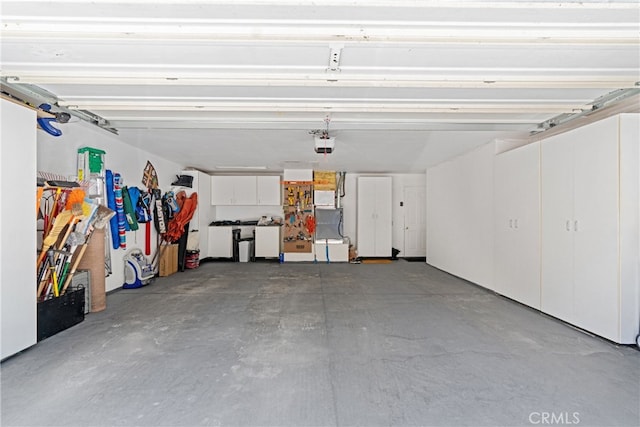 381 Old Toll Rd, Lake Arrowhead, CA 92317 - garage featuring washer and clothes dryer and a garage door opener