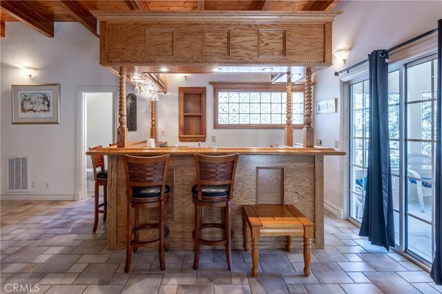 381 Old Toll Rd, Lake Arrowhead, CA 92317 - bar featuring visible vents, wet bar, stone tile floors, and wood ceiling