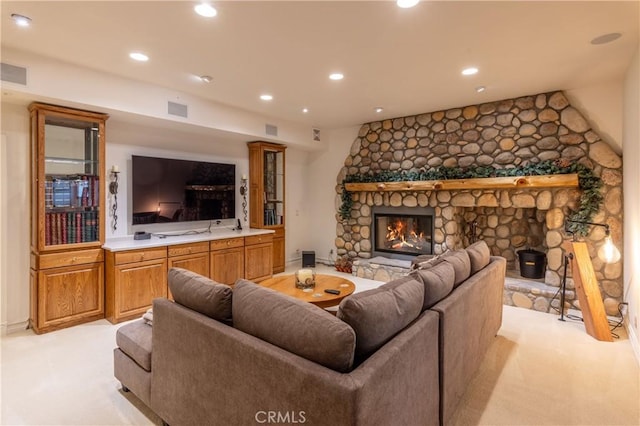 381 Old Toll Rd, Lake Arrowhead, CA 92317 - living room featuring visible vents, a stone fireplace, recessed lighting, and light colored carpet