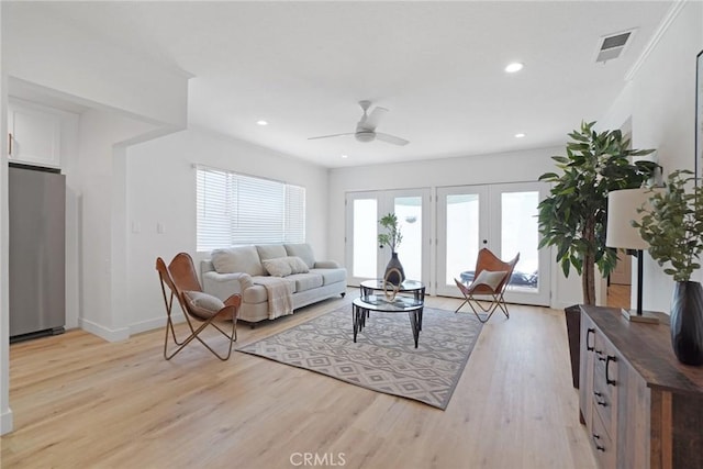 living room featuring recessed lighting, french doors, visible vents, ceiling fan, and light wood finished floors