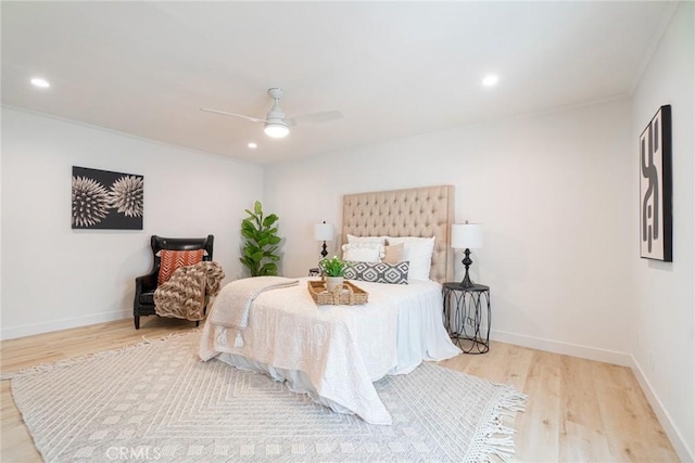 bedroom featuring baseboards, recessed lighting, crown molding, a ceiling fan, and wood finished floors
