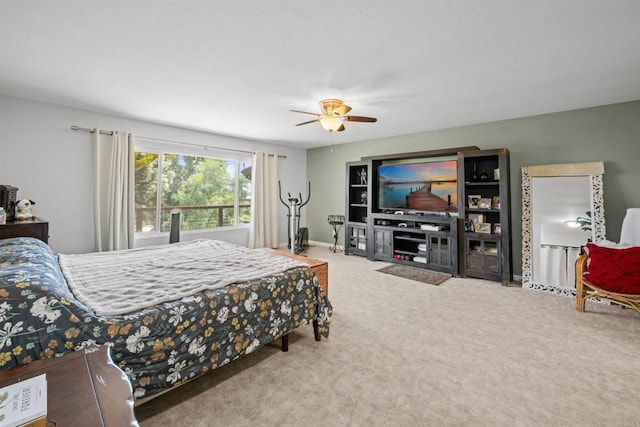 bedroom featuring ceiling fan, carpet, and baseboards
