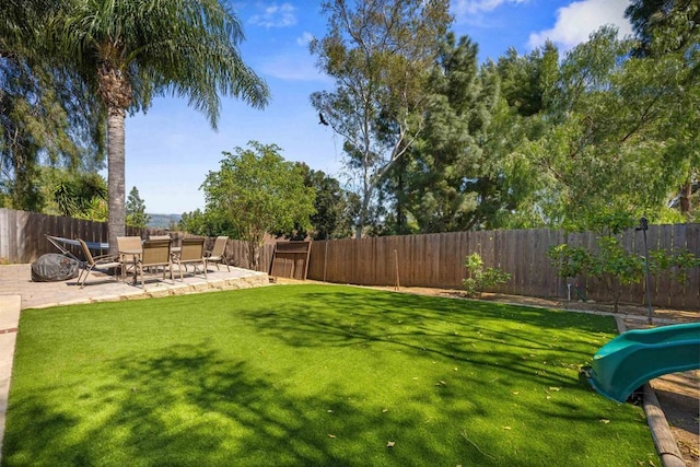 view of yard with a fenced backyard and a patio area